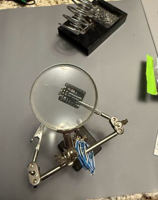 Xiao module separated from Wio module, showing tiny battery pads