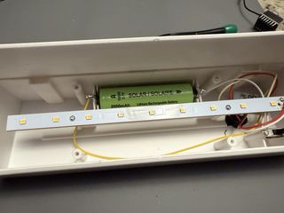 Battery compartment showing positive and negative terminals