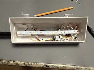 Components assembled inside housing with antenna installed